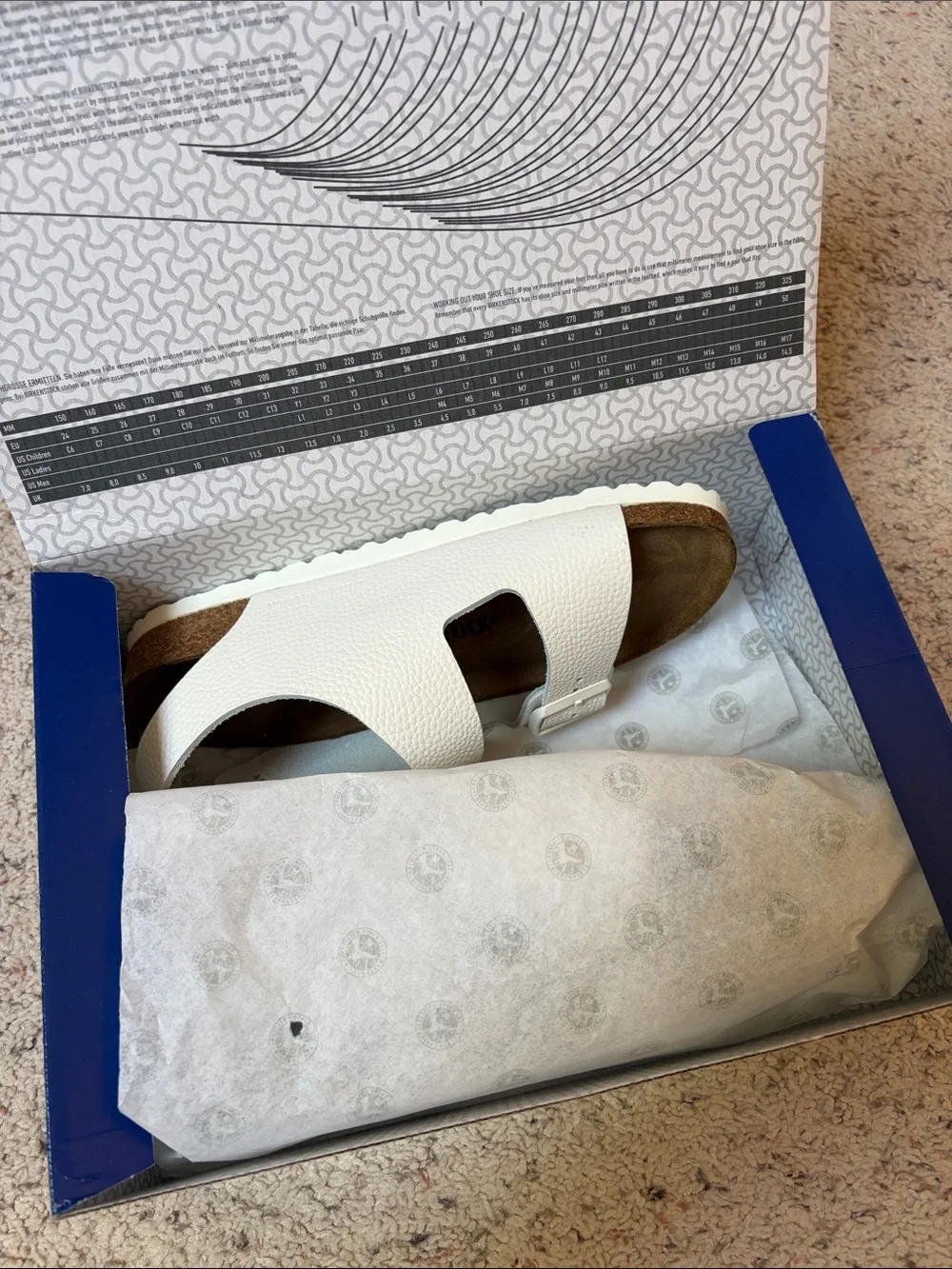 Narrow Birkenstock Cream White Two-Strap Sandal with Buckles